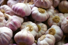 Garlic cloves on market display.